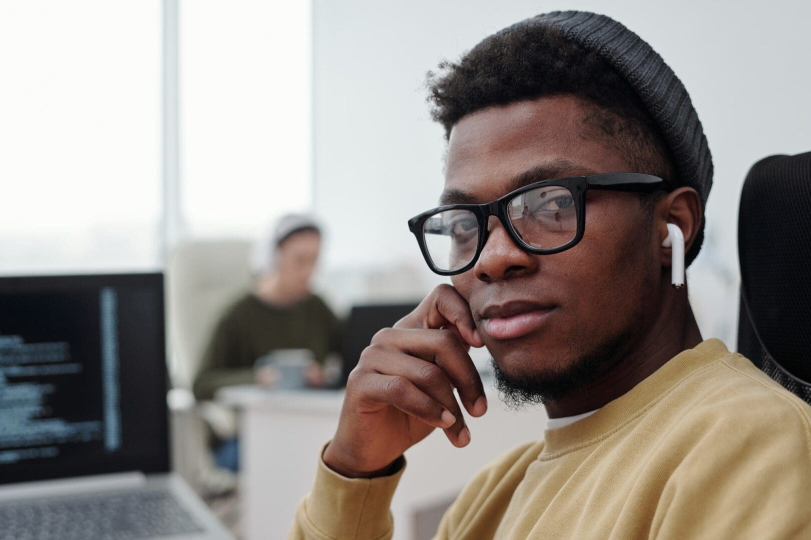 Face of young serious African American male programmer looking at camera